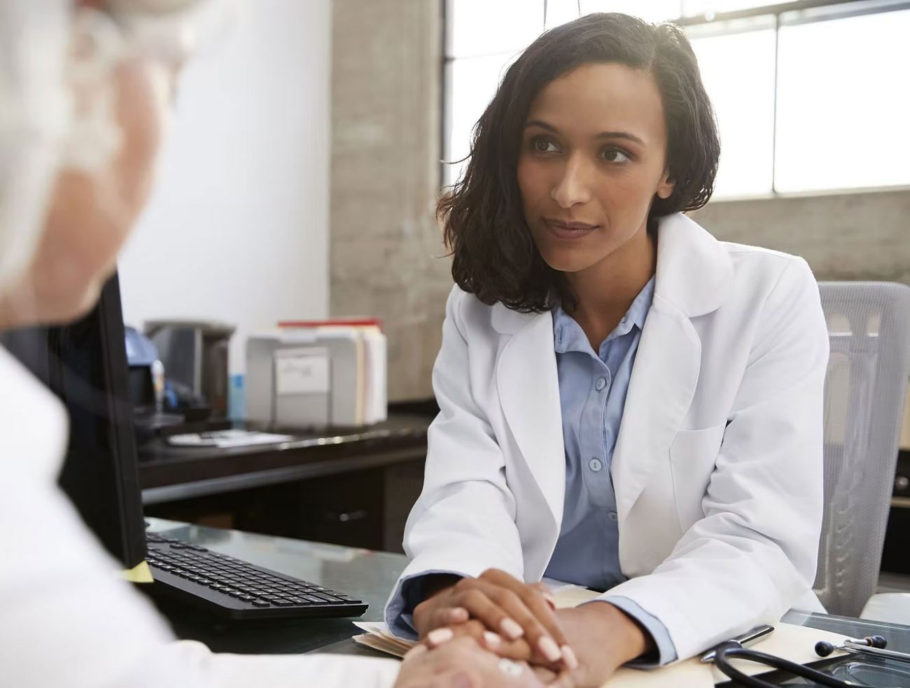 Doctor consulting with patient